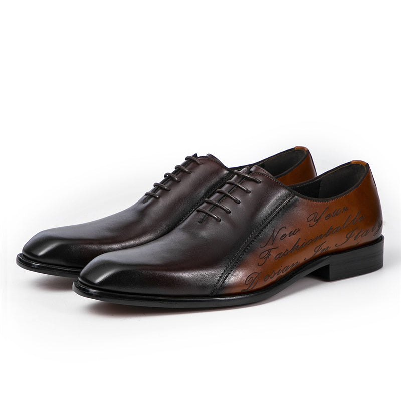 Pair of brown leather dress shoes on a white background