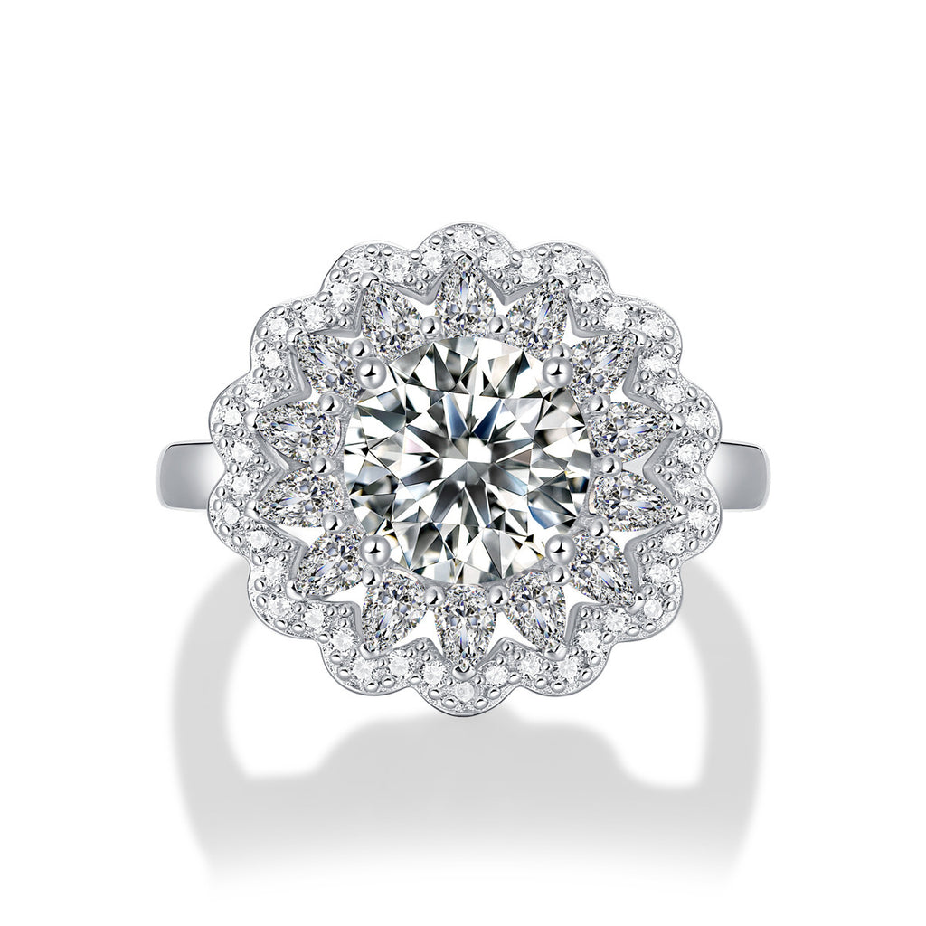 Diamond ring with floral halo on a white background