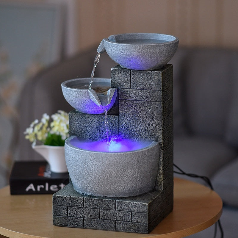 Fountain with LED lights on a table in a room setting