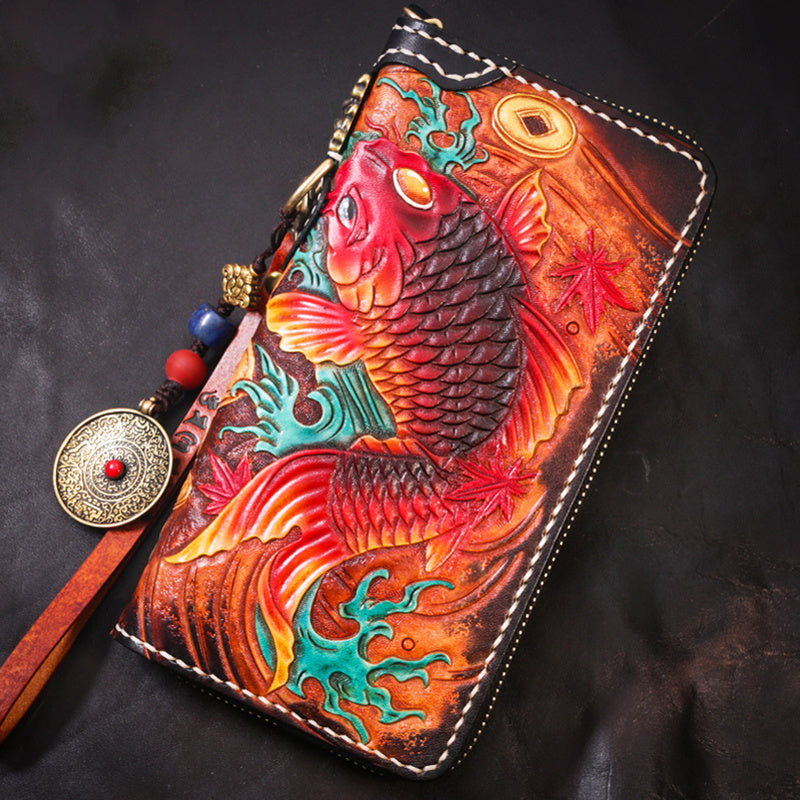 Handcrafted leather wallet with fish design on a dark background