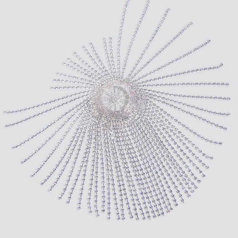 Decorative sunburst pattern with radiating lines on a light gray background