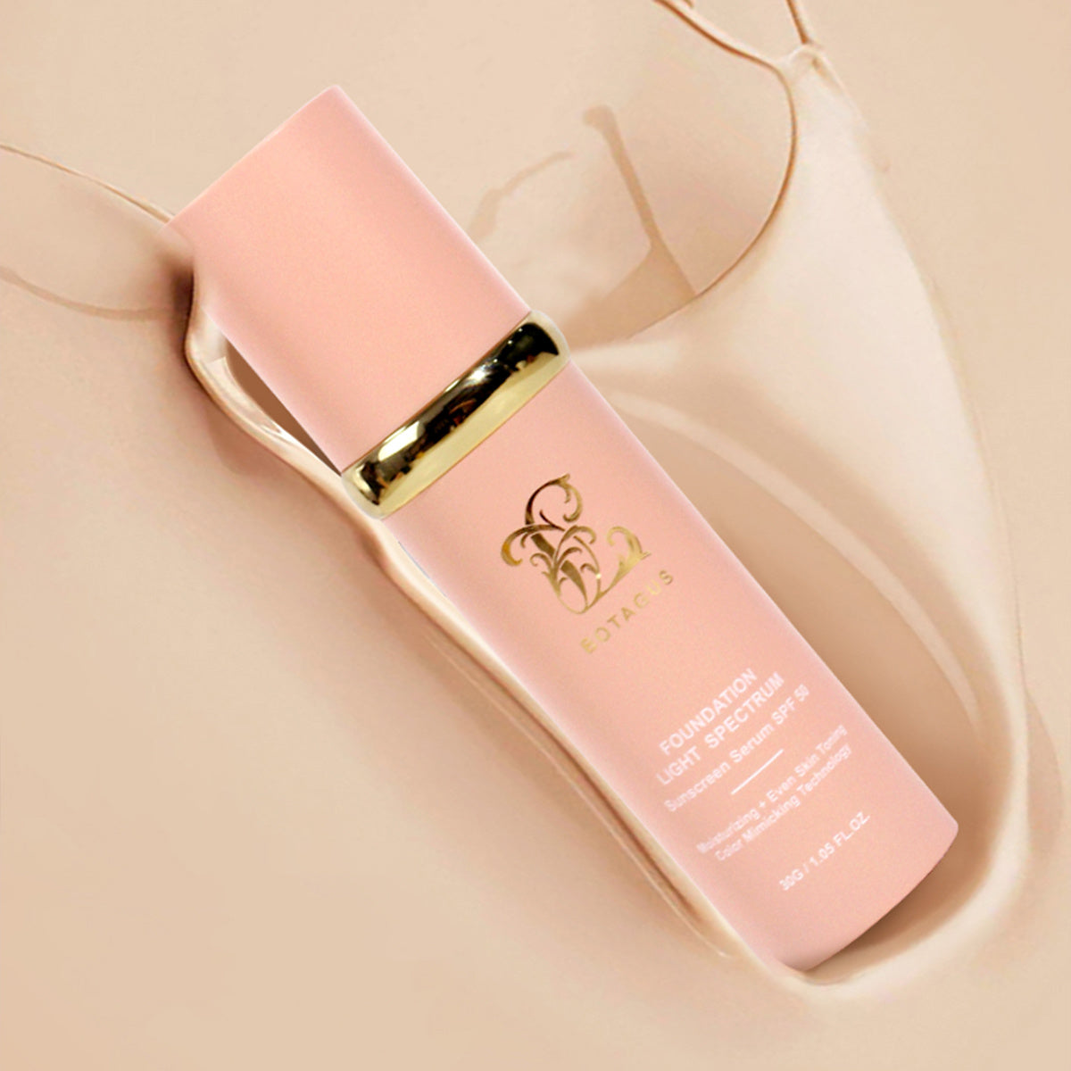 Pink skincare bottle with gold cap on a beige background