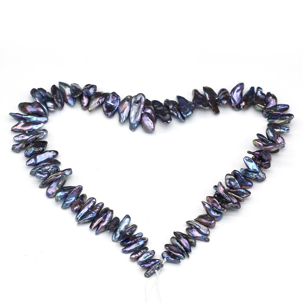 Necklace with purple and black iridescent beads forming a heart shape on a white background