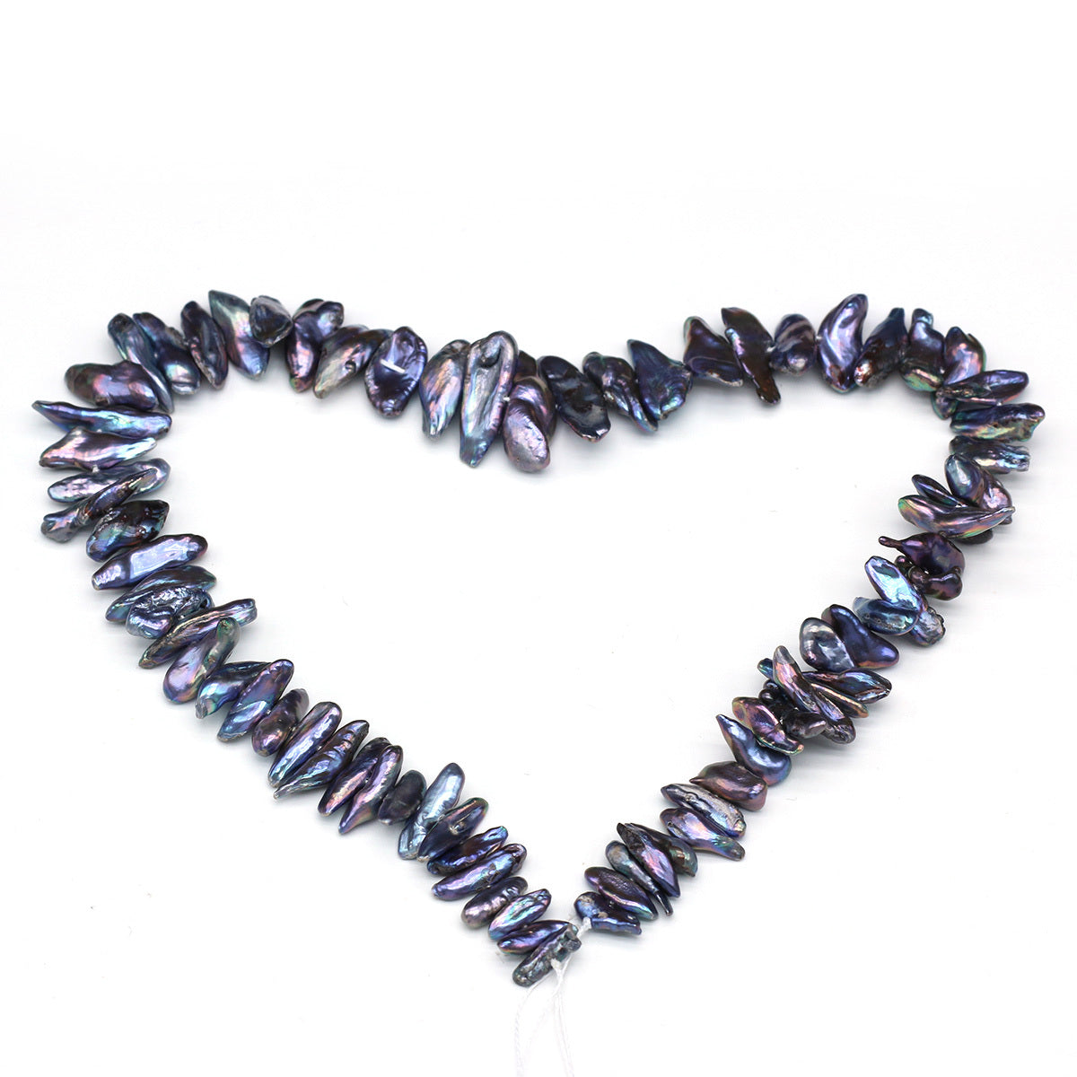 Necklace with purple and black iridescent beads forming a heart shape on a white background