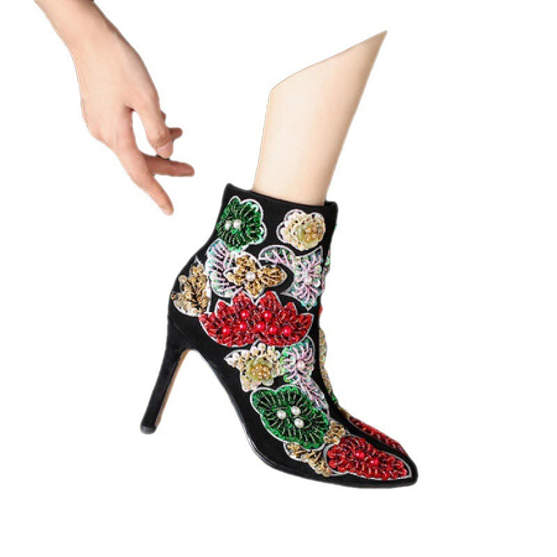 Decorative ankle boot with floral patterns on a white background