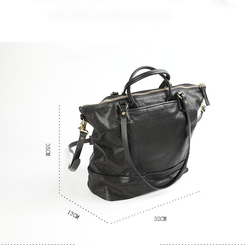 Black leather handbag with measurements on a white background