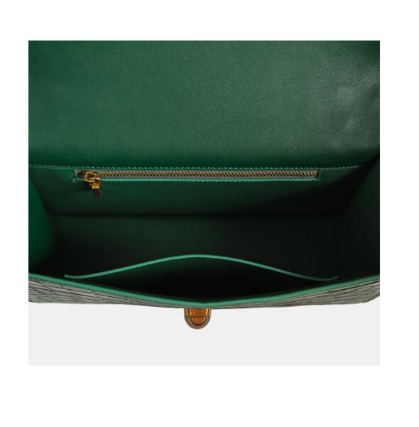 Green handbag with a gold clasp on a white background