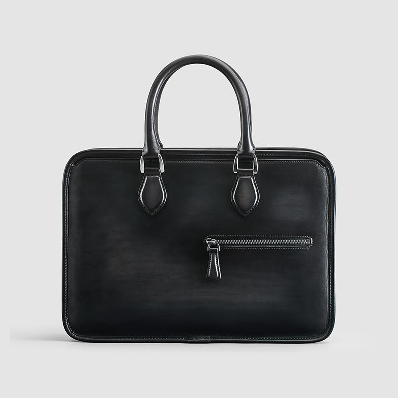 Black leather briefcase on a light gray background