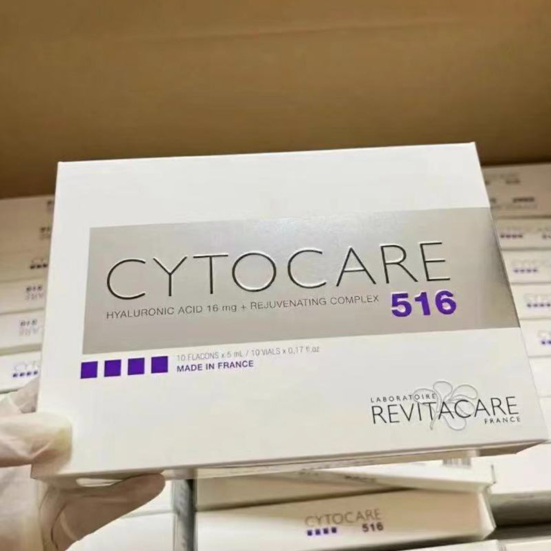 Cytocare 516 packaging held by a gloved hand with more boxes in the background.