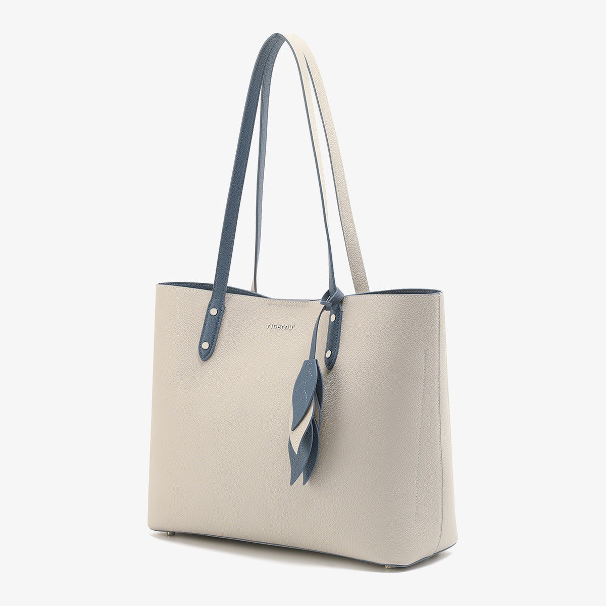 Beige handbag with blue accents on a white background