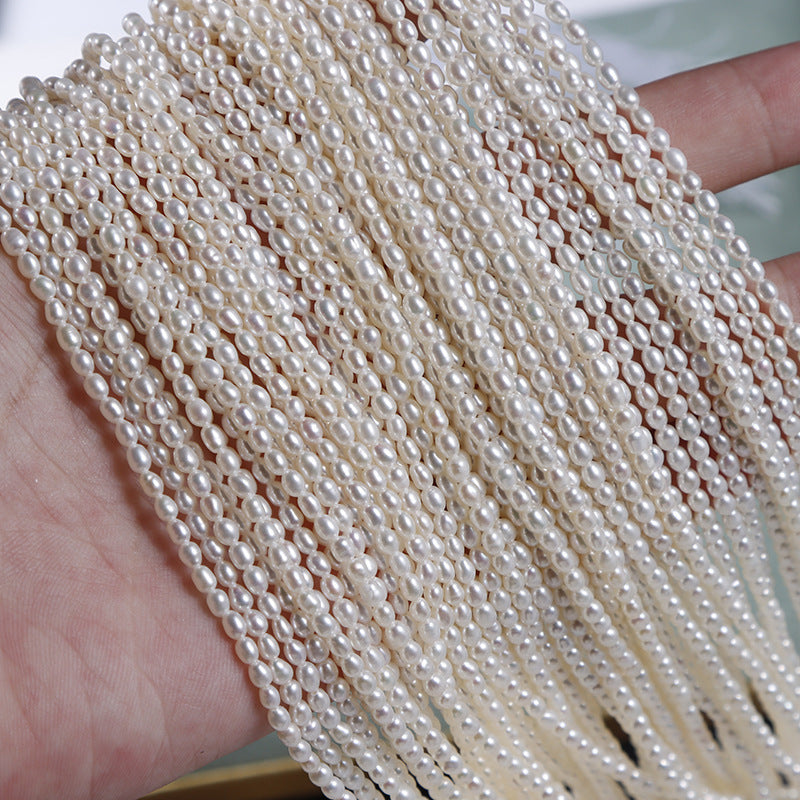 Close-up of a strand of pearls held in hand