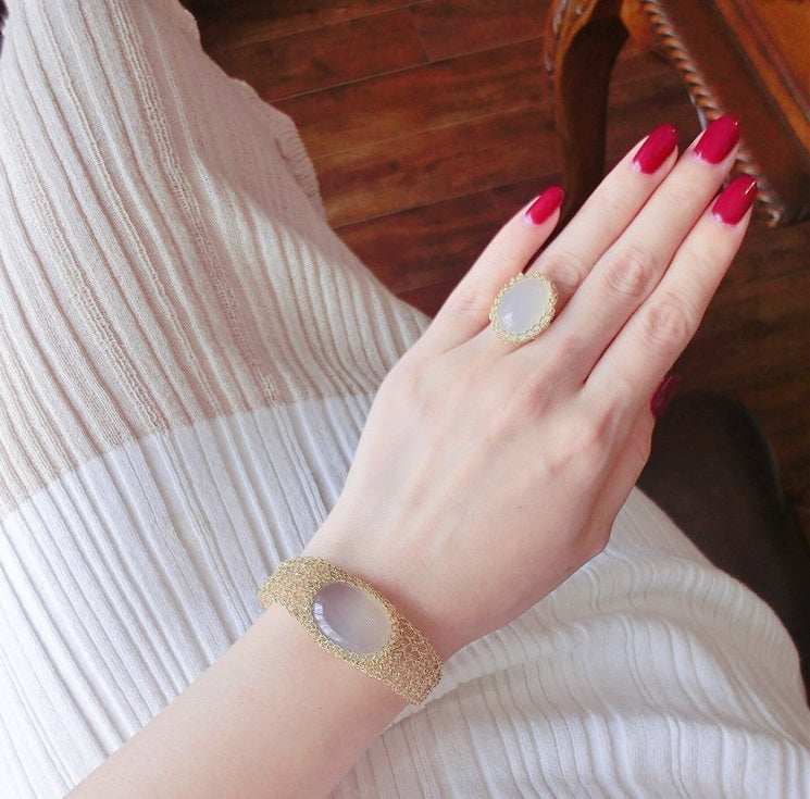 14k Gold Wire Natural White Chalcedony Bracelet worn on wrist with matching ring and red nail polish