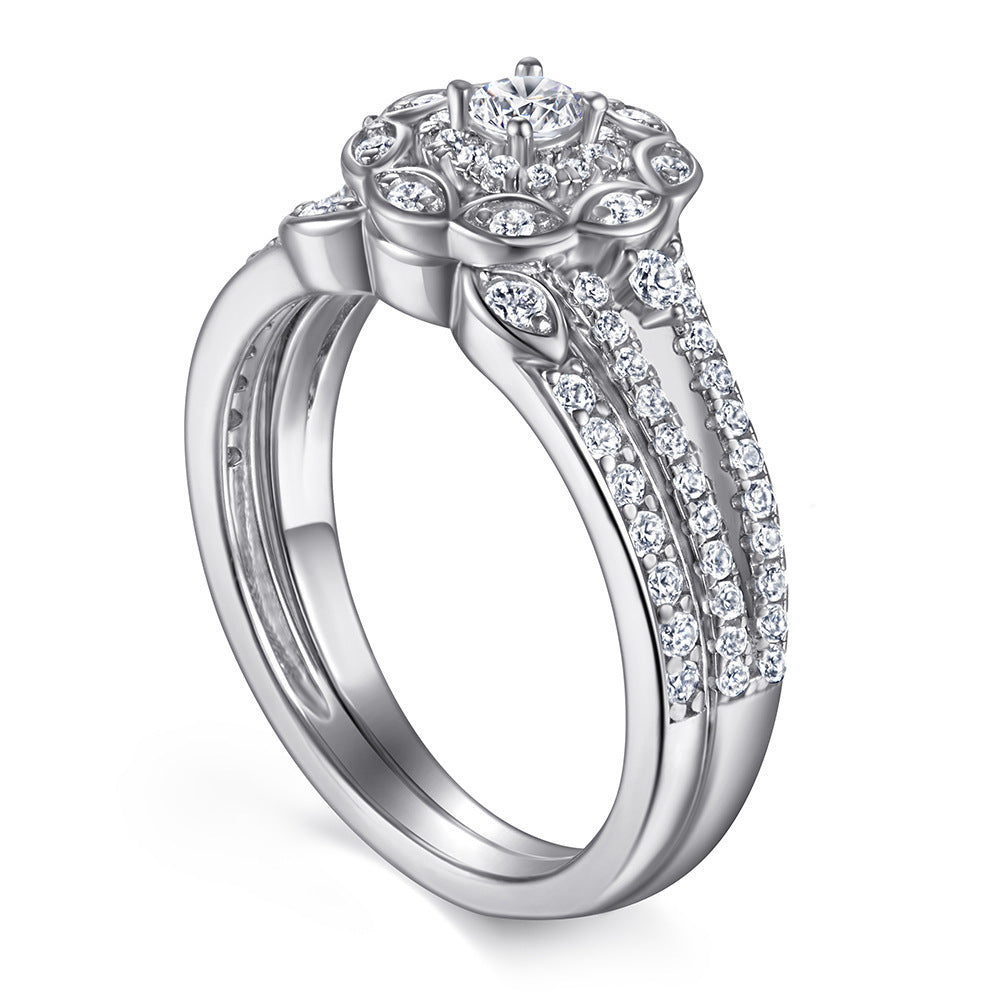 Silver ring with diamond accents on a white background