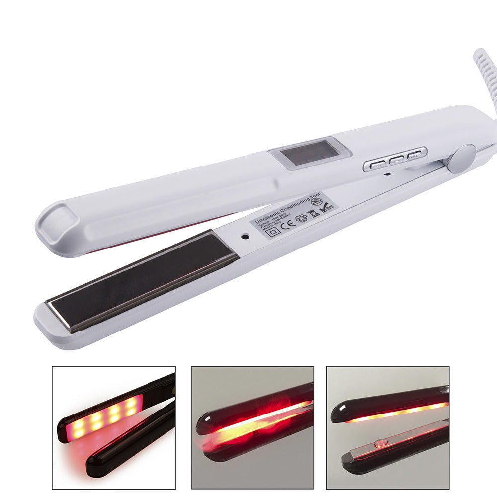 White hair straightener with digital display on a white background