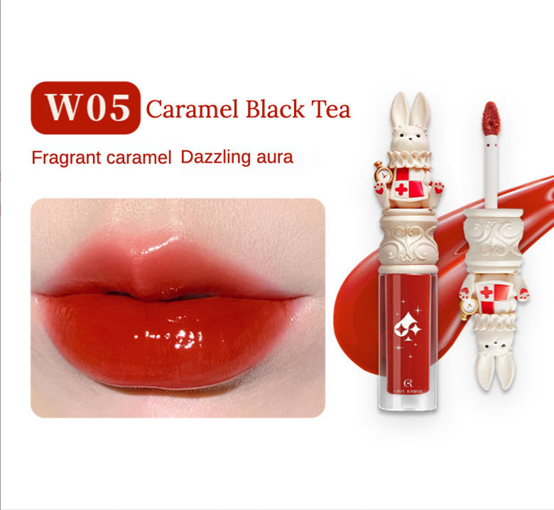 Lip gloss with rabbit design and 'W05 Caramel Black Tea' text on a white background