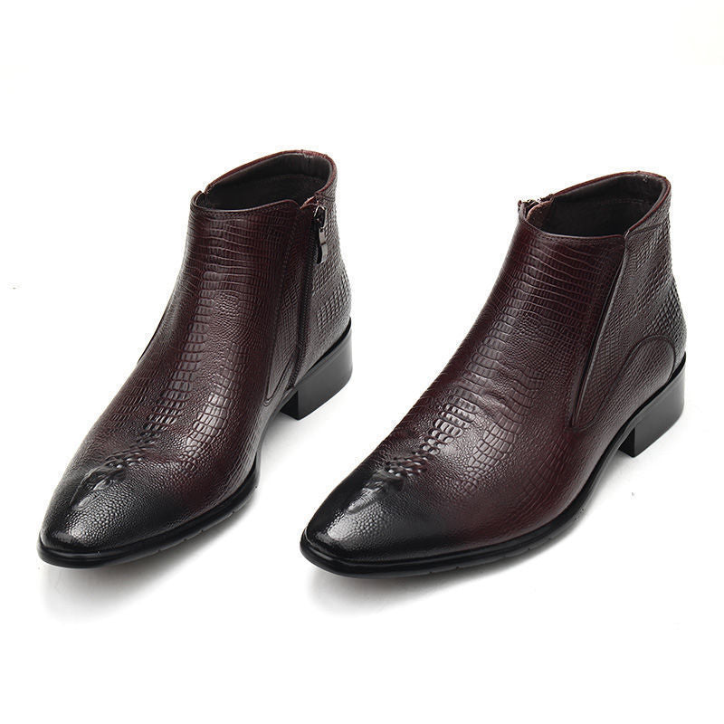 Pair of brown leather ankle boots with textured finish on a white background
