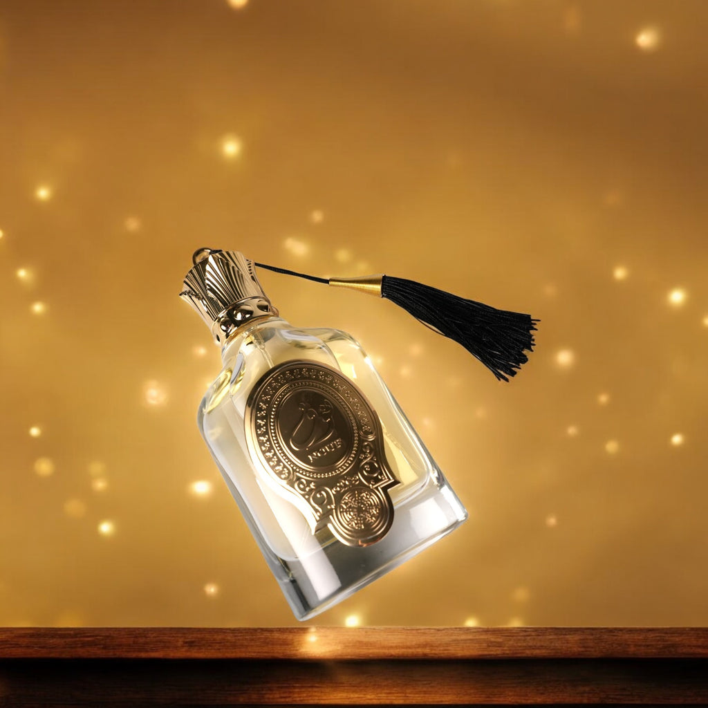 Decorative bottle with a tassel on a gold background
