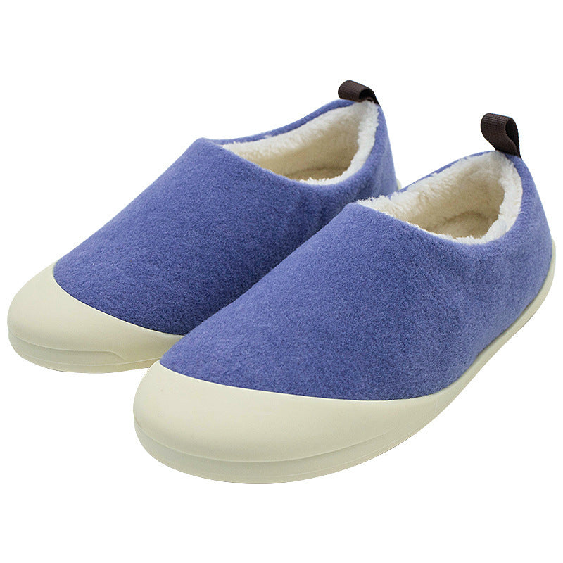 Pair of blue slippers with white soles on a white background
