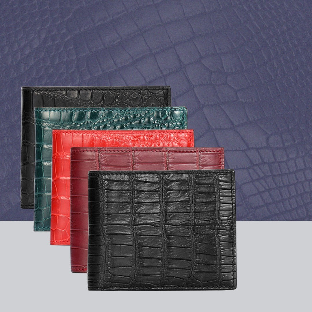 Four leather wallets in black, green, red, and burgundy on a textured purple background