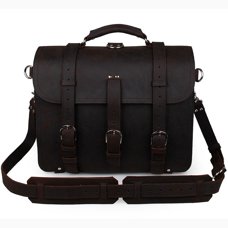 Black leather briefcase with straps on a white background