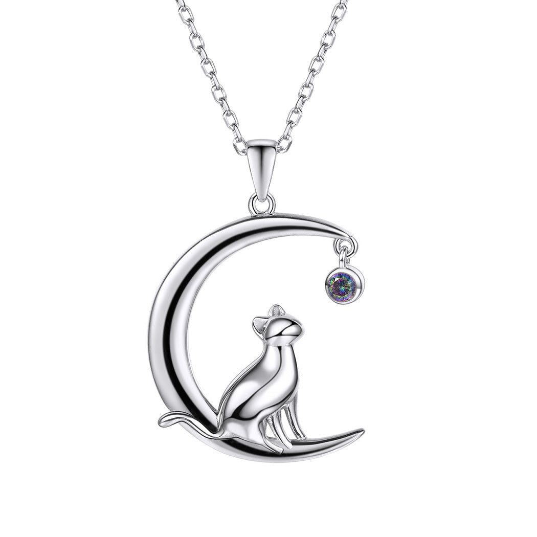 Silver necklace with a crescent moon and owl pendant on a white background