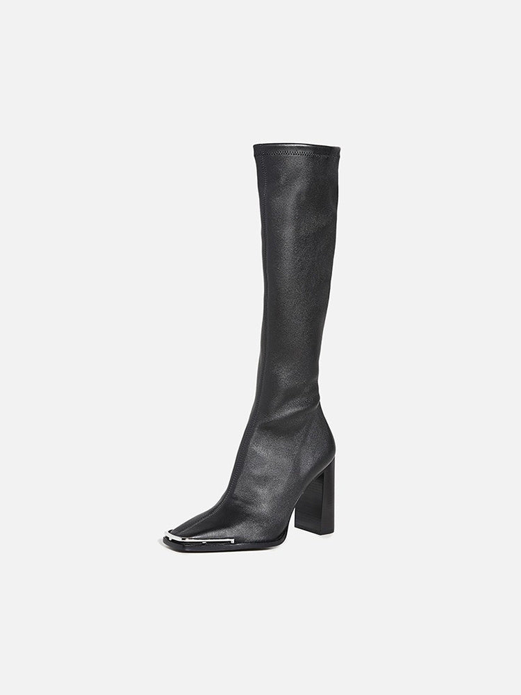 Black knee-high boot on a white background