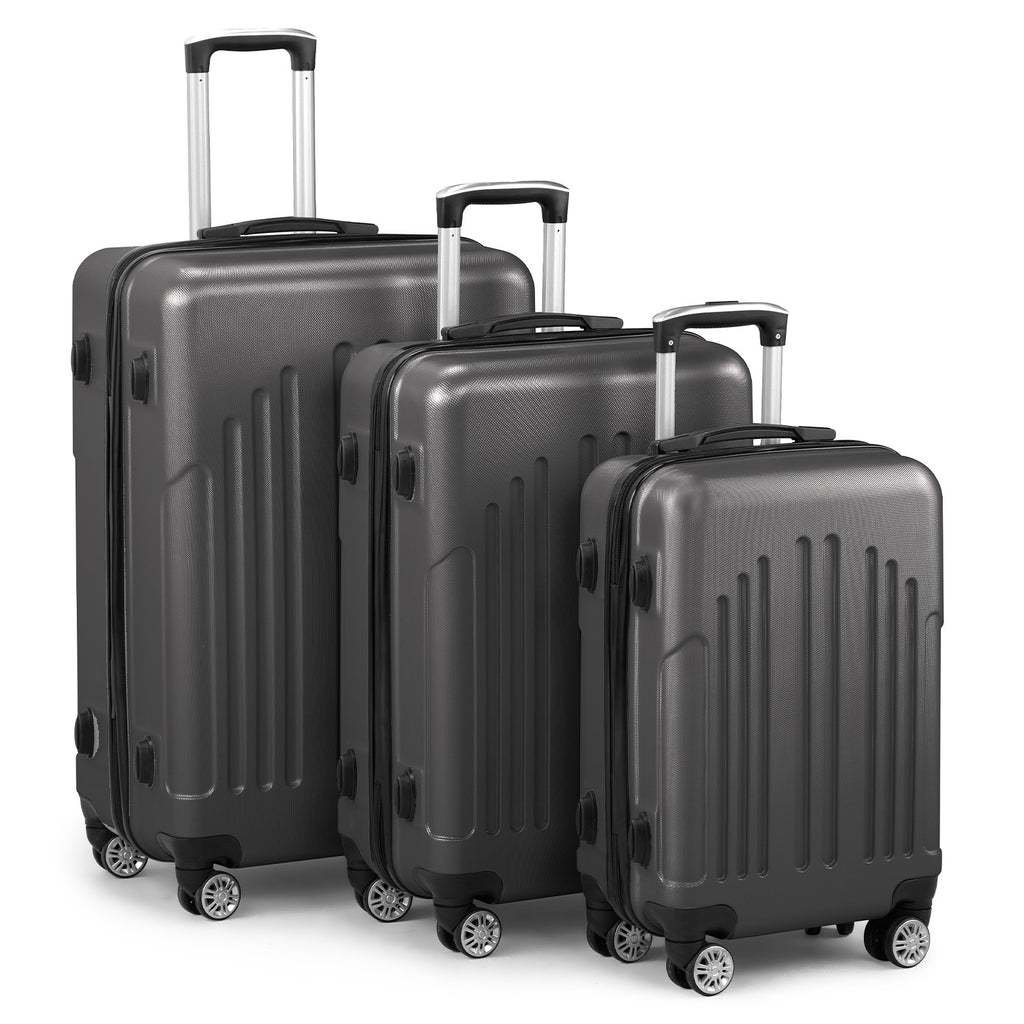 Three black suitcases of different sizes on a white background