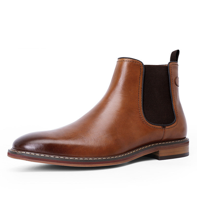 Brown leather Chelsea boot on a white background