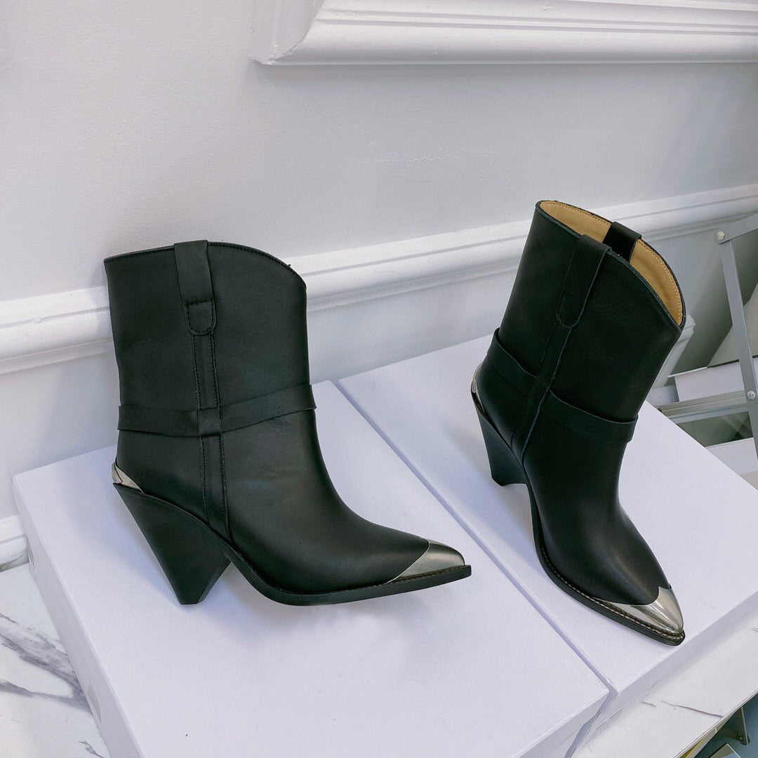 Pair of black leather boots with metallic heel and toe on a white surface.