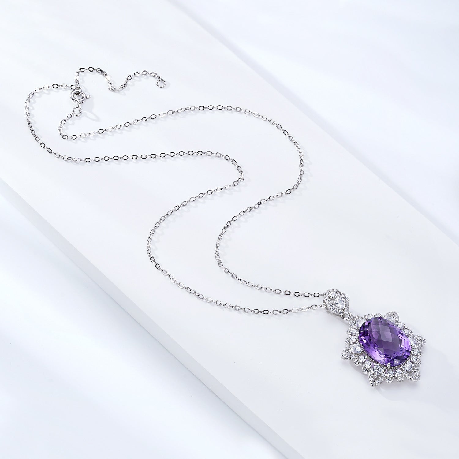 Necklace with a purple gemstone pendant on a white background