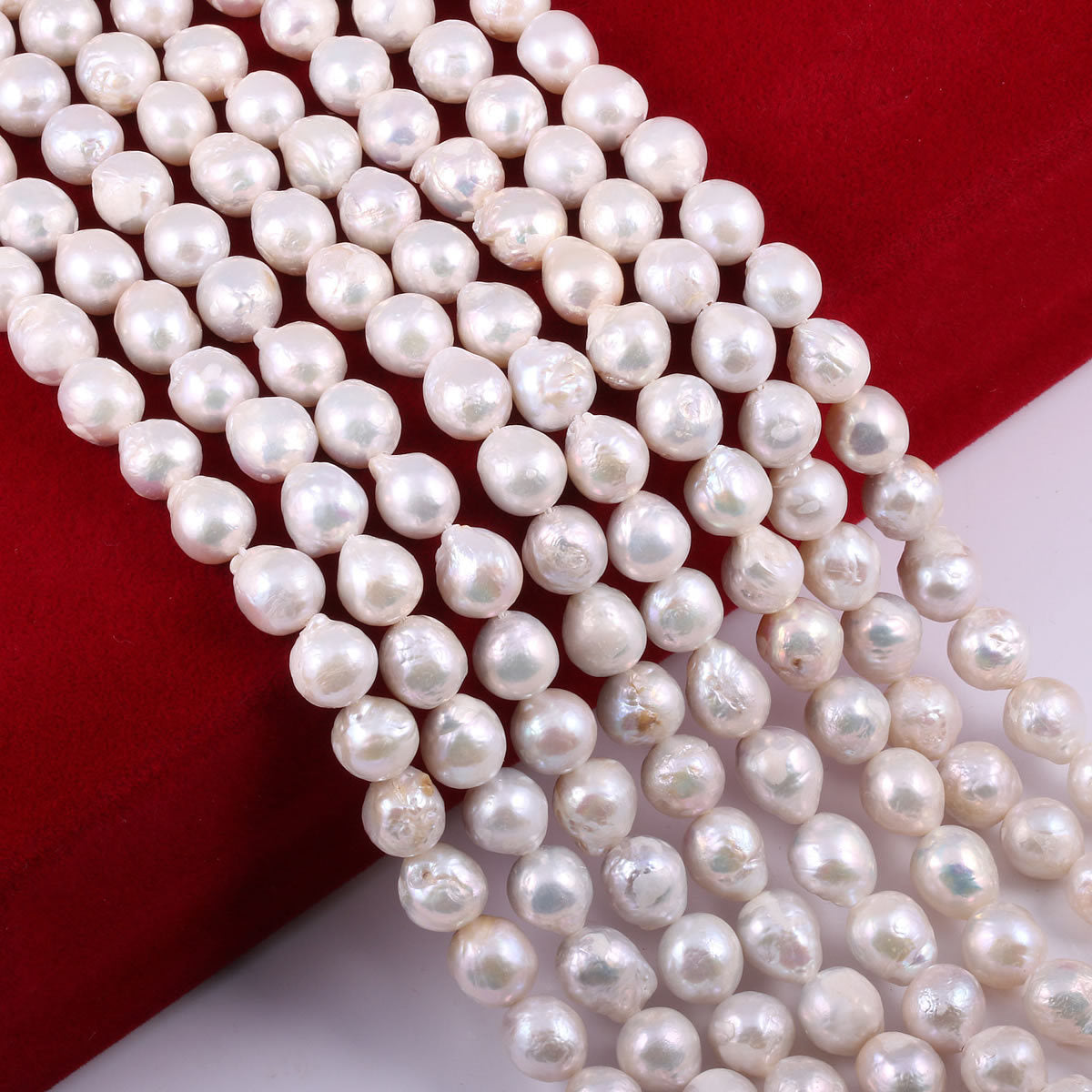 String of white pearls on a red and white background