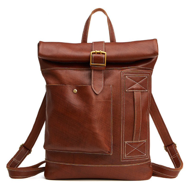 Brown leather backpack with gold buckle on a white background