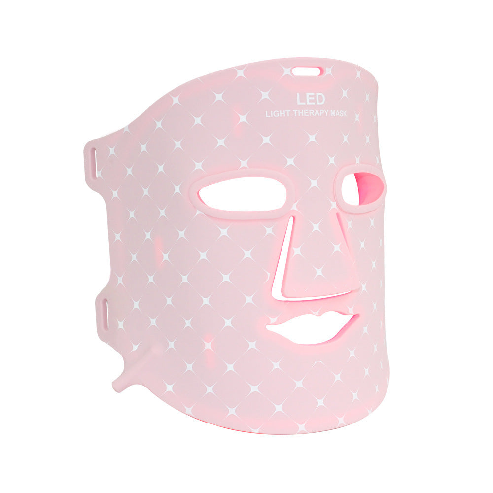 Pink LED face mask on a white background