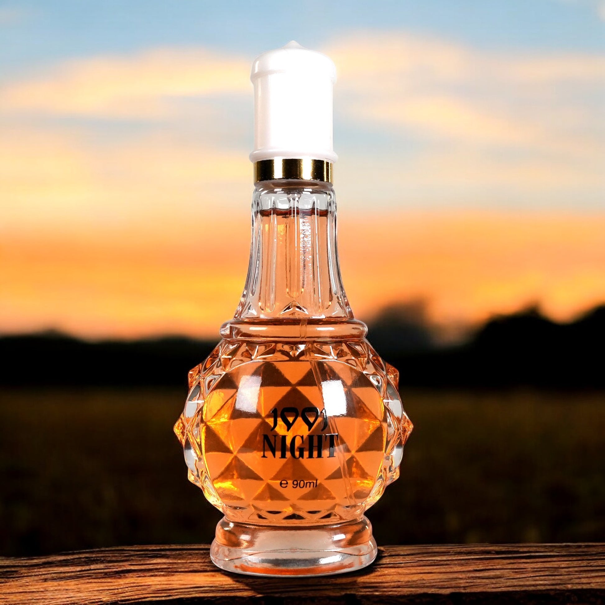 Perfume bottle labeled 'Good Night' with a sunset background