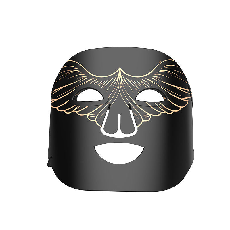 Black mask with gold accents on a white background