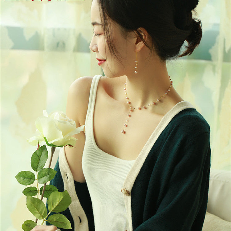 Woman holding a white rose with a blurred background