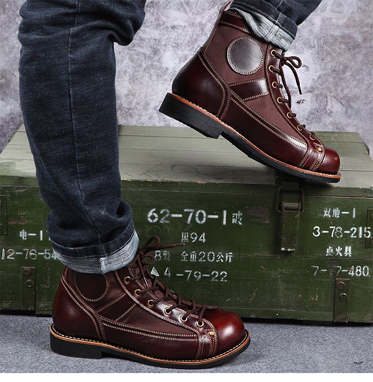 Brown leather boots worn by a person on a green military-style crate with a gray background