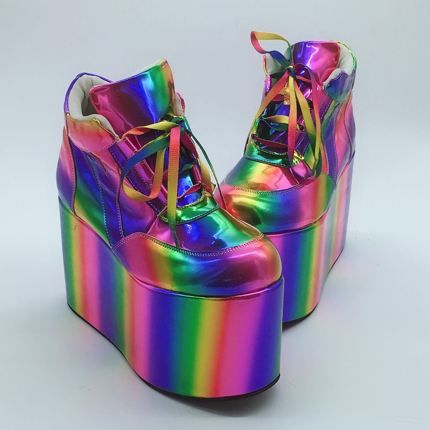 Multicolored platform shoes on a light gray background