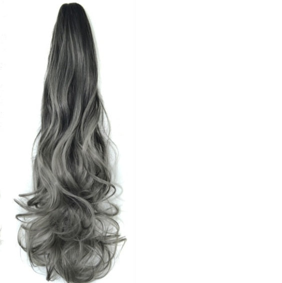 Long, wavy hair extension with gradient color on a white background