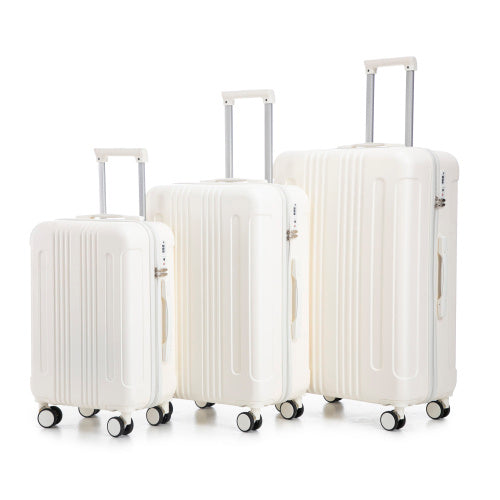 Set of three white suitcases with wheels on a white background