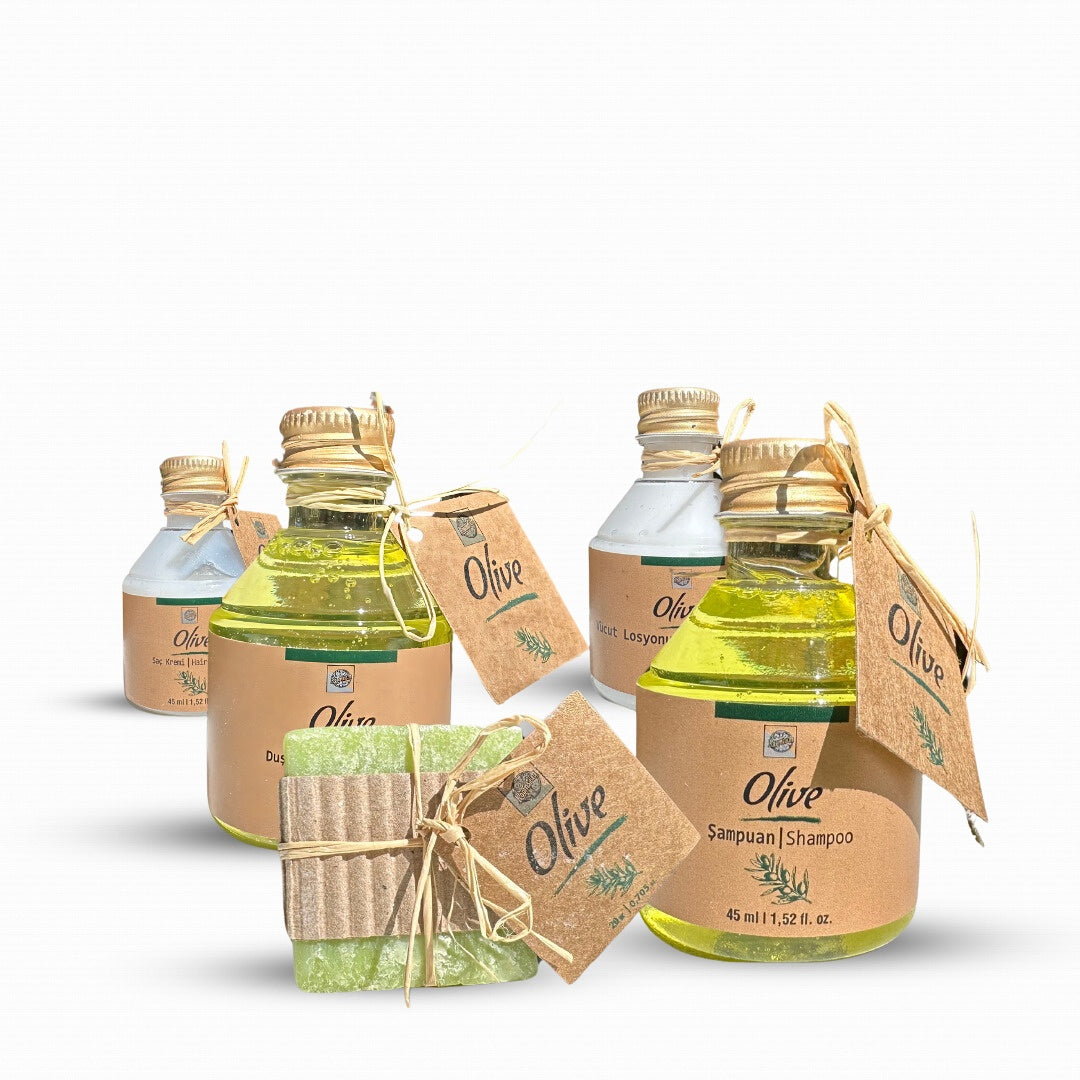 Olive oil products including bottles and a bar of soap on a white background