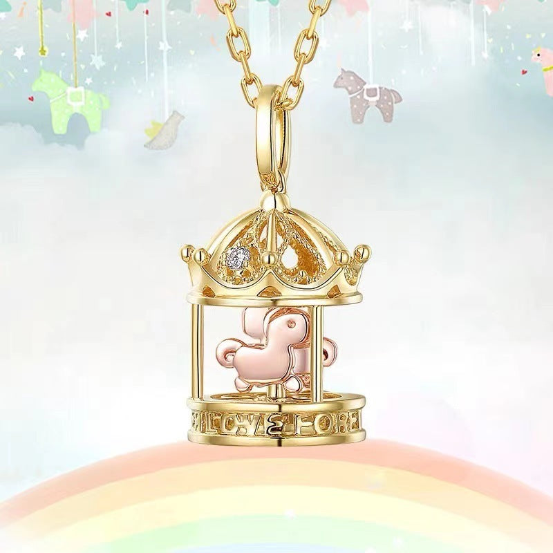 Gold necklace with a pink piggy bank pendant on a colorful background