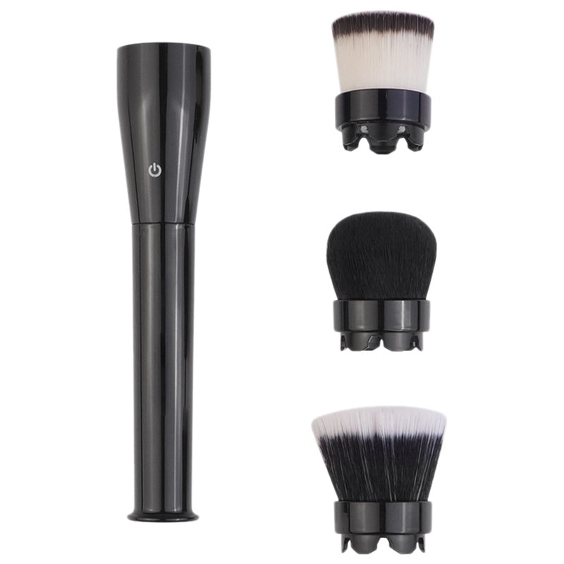 Set of makeup brushes with black handles and white bristles on a white background