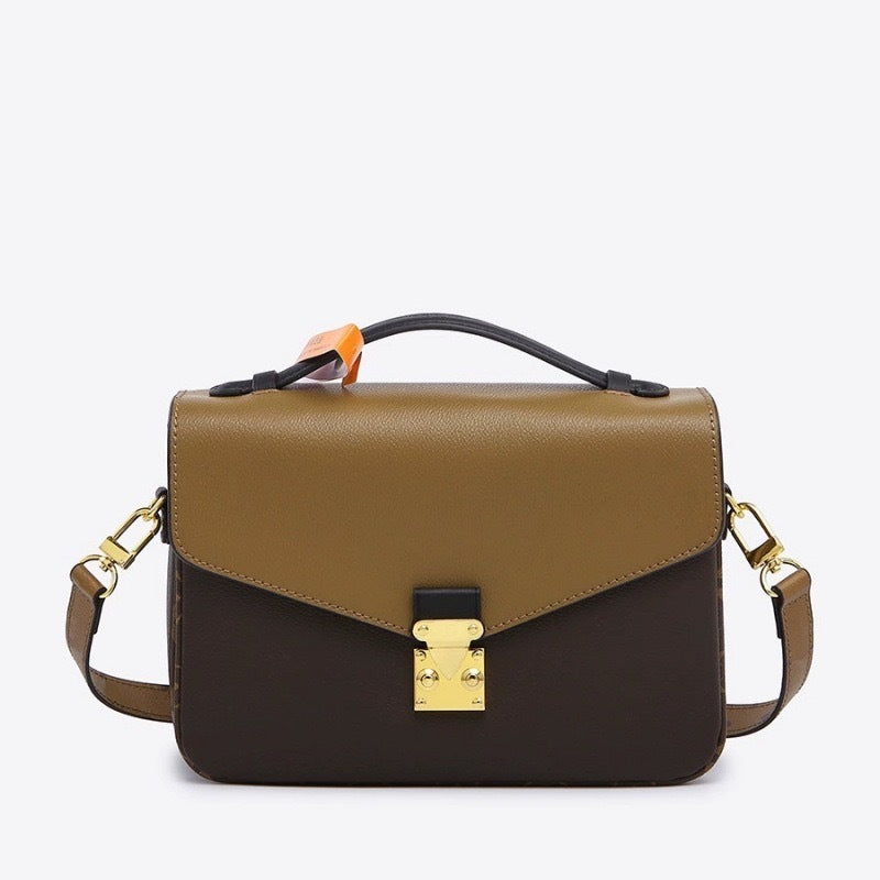 Two-tone brown handbag with a gold lock on a white background