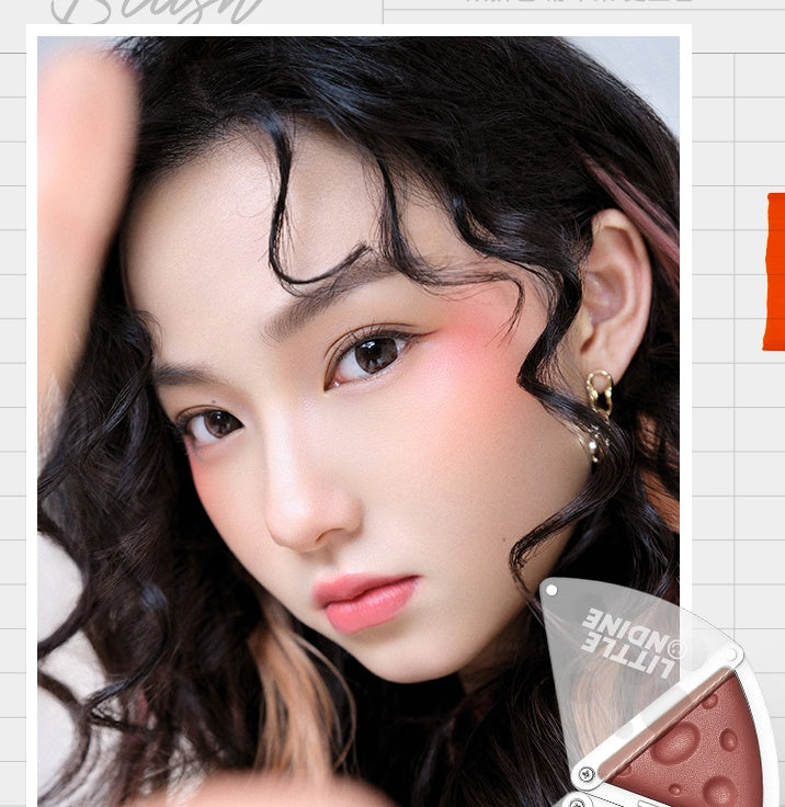 Close-up of a person with wavy hair and makeup product in the corner