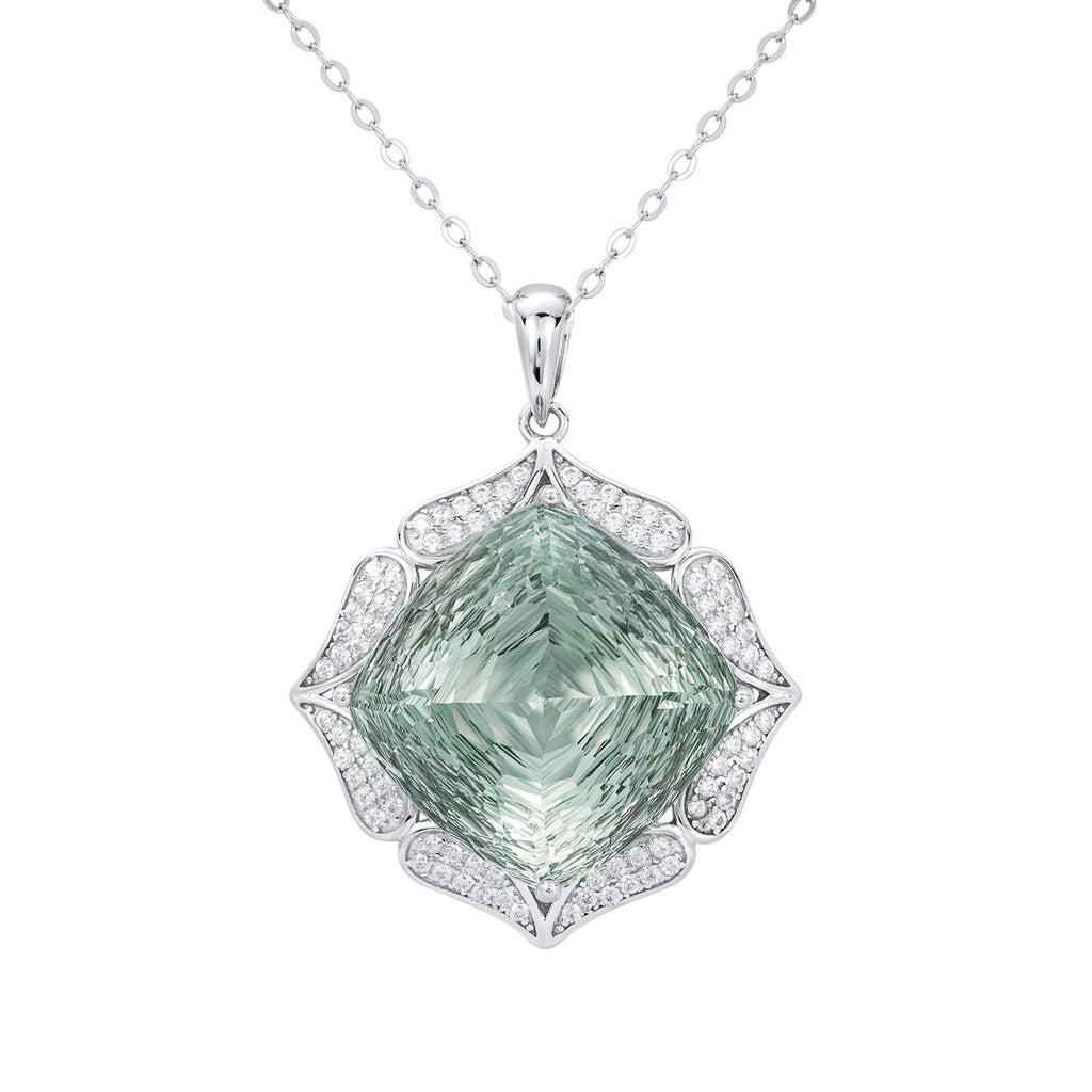 Green gemstone pendant with silver frame on a white background