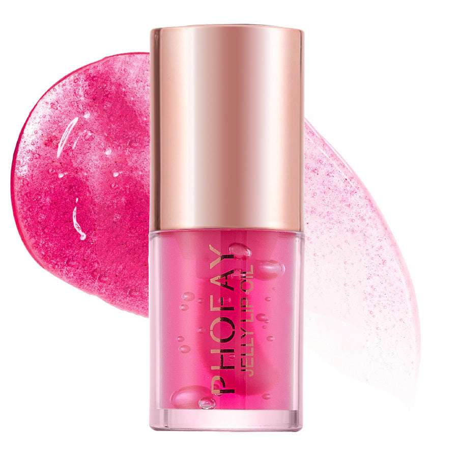 Pink lip gloss with gold cap on a white background
