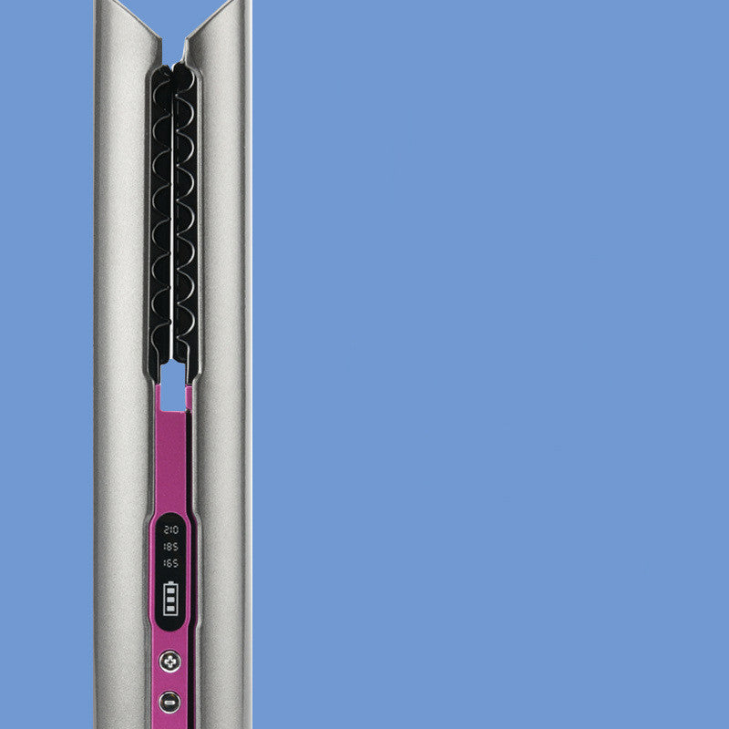 Close-up of a hair straightener with a blue background