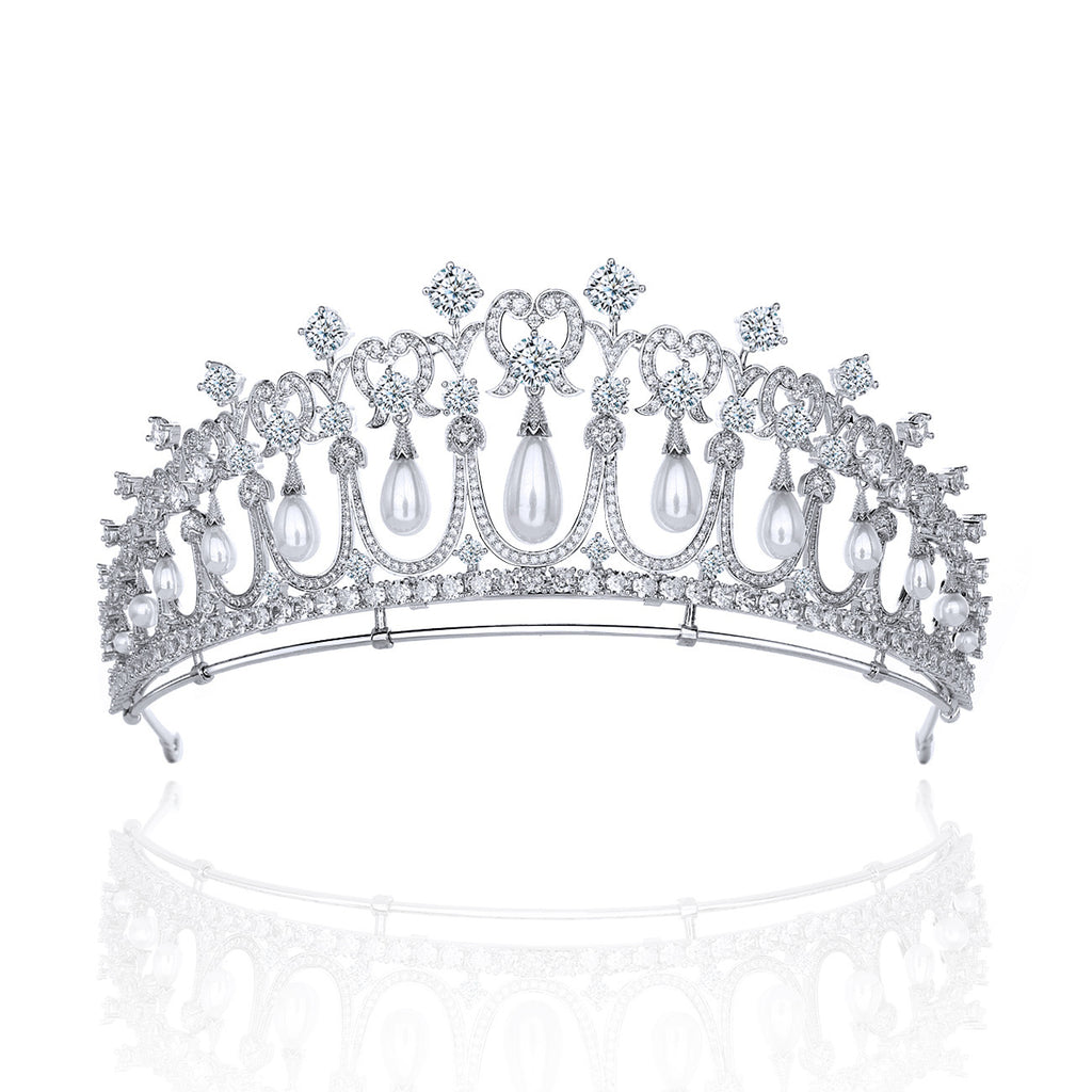 Elegant silver tiara with pearls and crystals on a white background