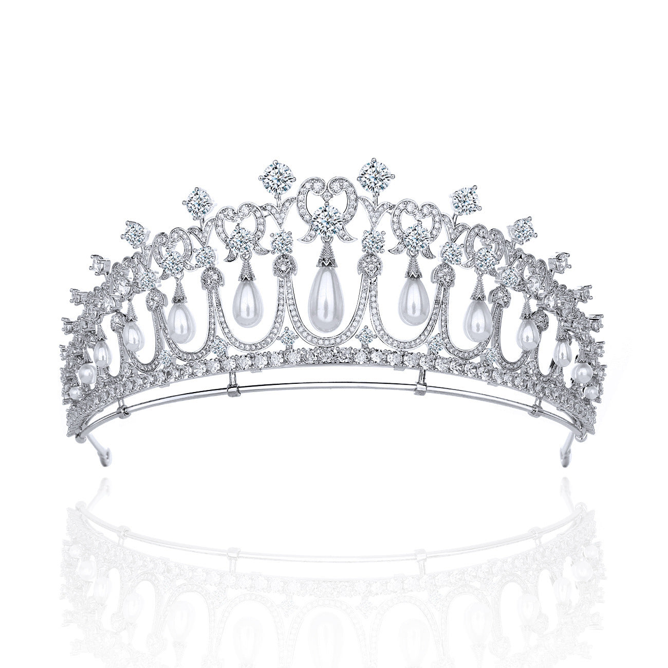 Elegant silver tiara with pearls and crystals on a white background